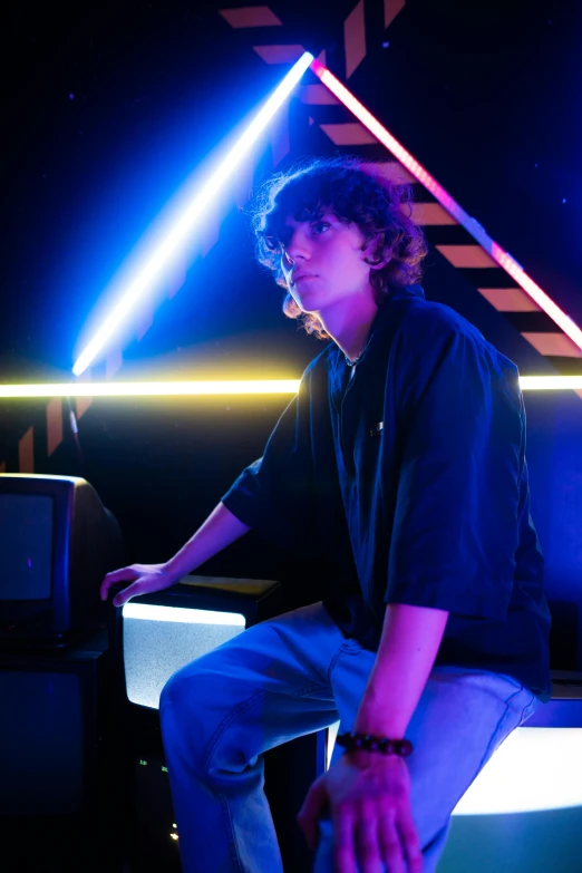 a man sitting on top of a piano in a dark room, an album cover, inspired by John Luke, standing in a starbase bar, teenage boy, laser, profile picture 1024px