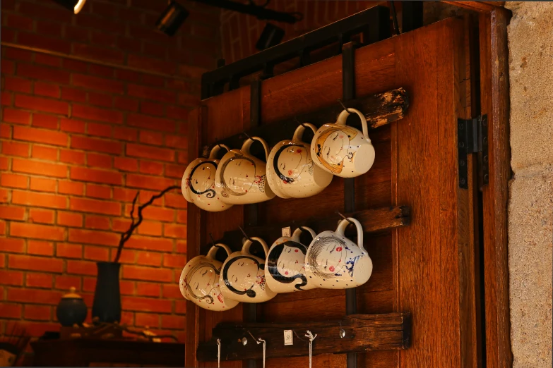 a bunch of cups that are hanging on a wall, a portrait, unsplash, mingei, rustic setting, shot on sony alpha dslr-a300, rack, taken with canon 5d mk4