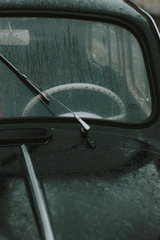 a close up of a car's windshield on a rainy day, by Sven Erixson, unsplash, photorealism, hoses, wielding a crowbar, simple nostalgic, paul barson