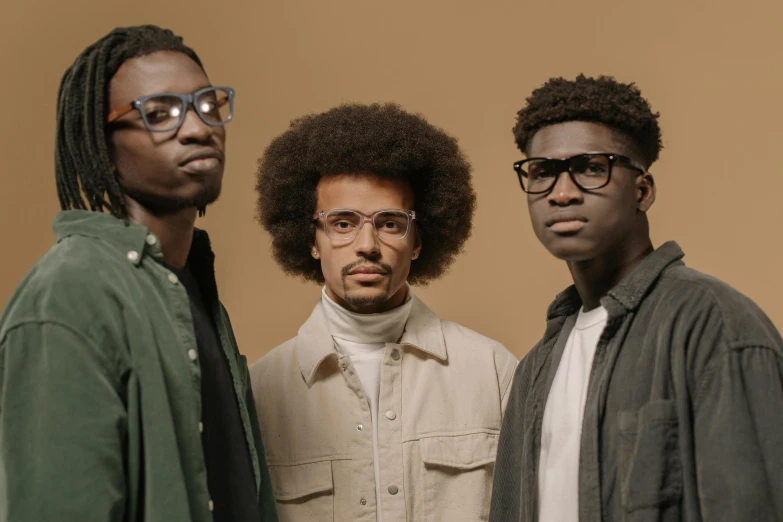 a group of three men standing next to each other, an album cover, by Nyuju Stumpy Brown, pexels contest winner, afrofuturism, square rimmed glasses, portrait shot 8 k, with afro, beautiful people