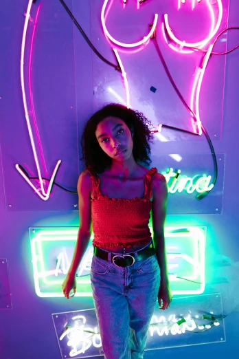 a woman standing in front of a neon sign, trending on pexels, portrait sophie mudd, ashteroth, ((neon colors)), infp girl