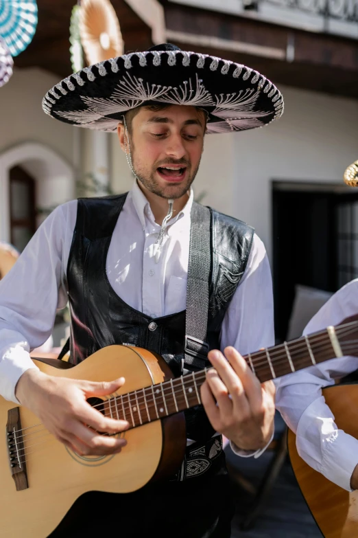 a couple of men that are playing guitars, inspired by Germán Londoño, wearing sombrero, singing, single image, square