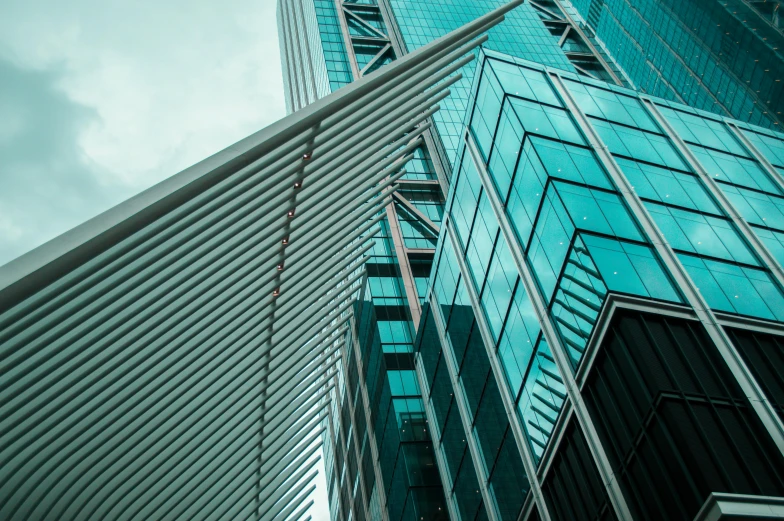 a couple of tall buildings next to each other, pexels contest winner, hypermodernism, aquamarine windows, square lines, steel and metal, commercial photo