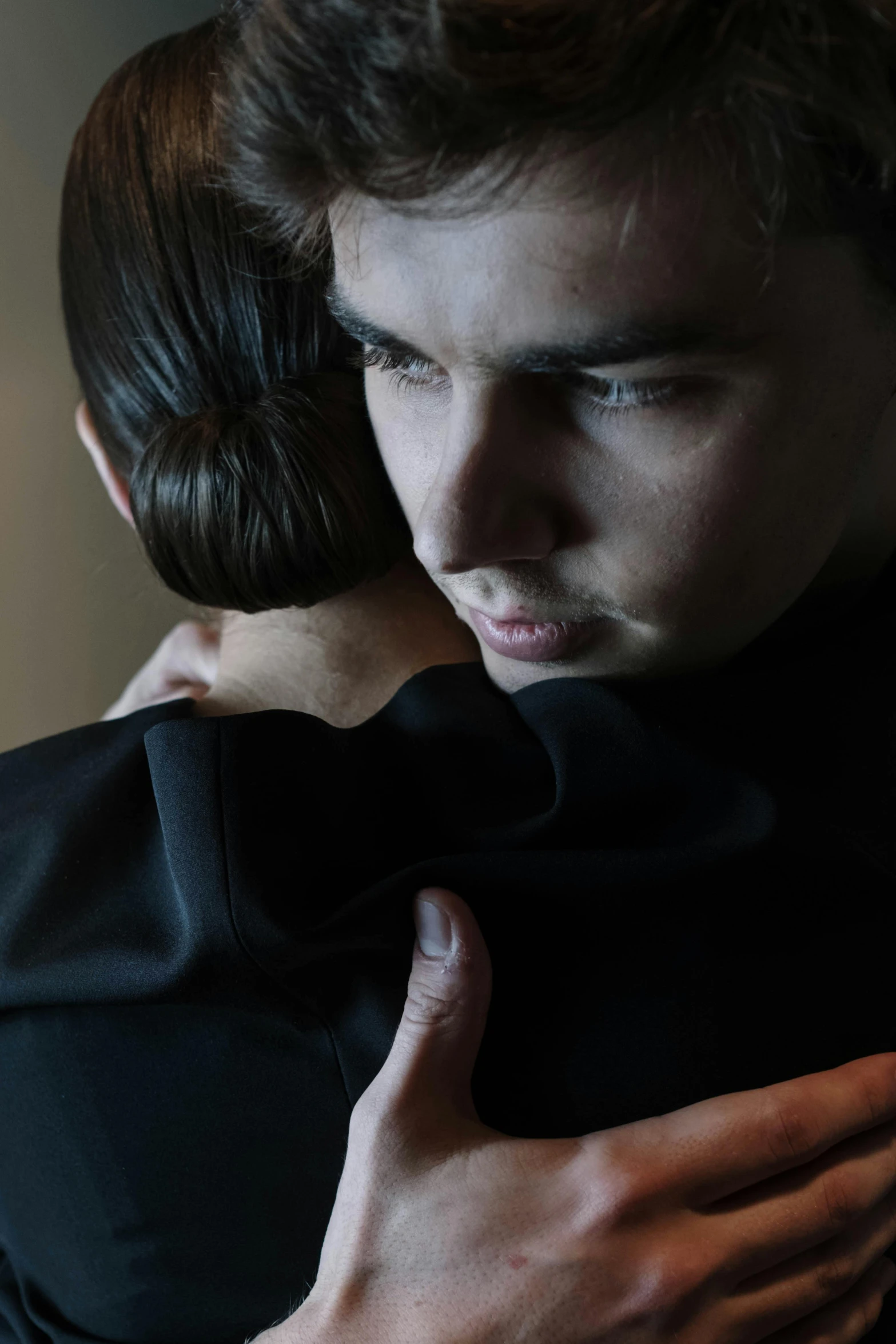 a couple of people that are hugging each other, an album cover, by Adam Marczyński, unsplash, romanticism, raf simons fashion couture, joe keery, concerned expression, 15081959 21121991 01012000 4k