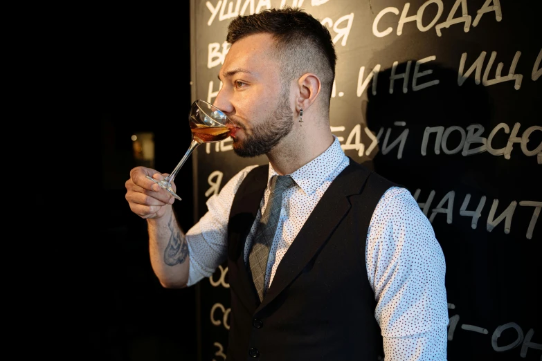 a man in a vest drinking a glass of wine, hurufiyya, professional profile picture, vadim voitekhovitch, profile image, elegantly dressed