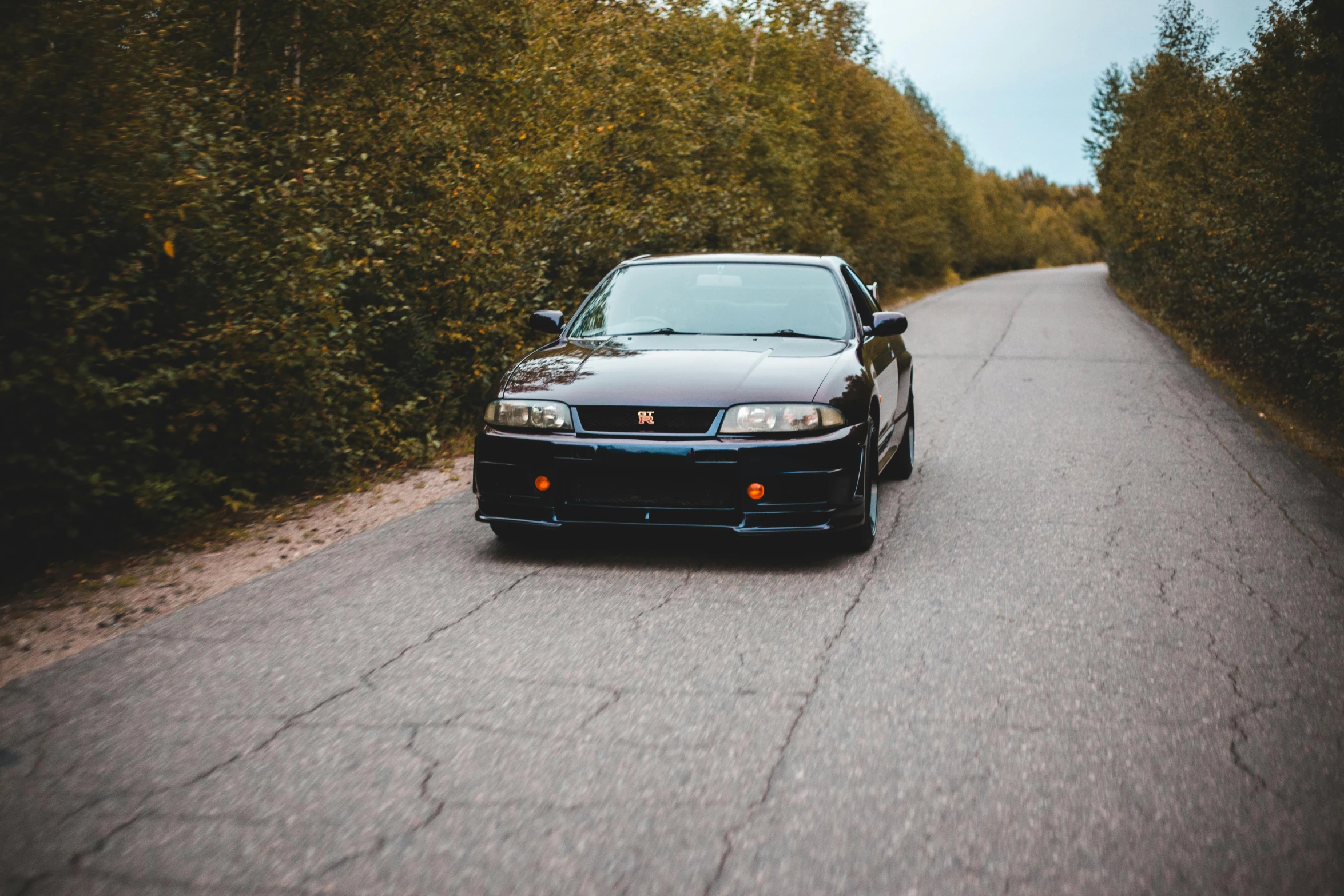 a black car parked on the side of a road, pexels contest winner, purism, in a modified nissan skyline r34, avatar image, russian and japanese mix, 🚿🗝📝