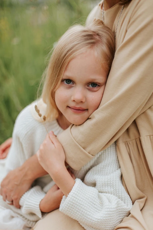 a woman holding a little girl in her arms, pexels contest winner, portrait of nordic girl, hugging his knees, closeup of an adorable, 15081959 21121991 01012000 4k