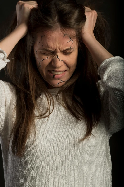 a woman holding her hair in front of her face, as well as scratches, sfx, showing anger, inside head cobwebs