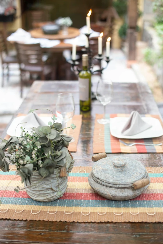 a wooden table topped with plates and utensils, outside, tlaquepaque, profile image, eucalyptus