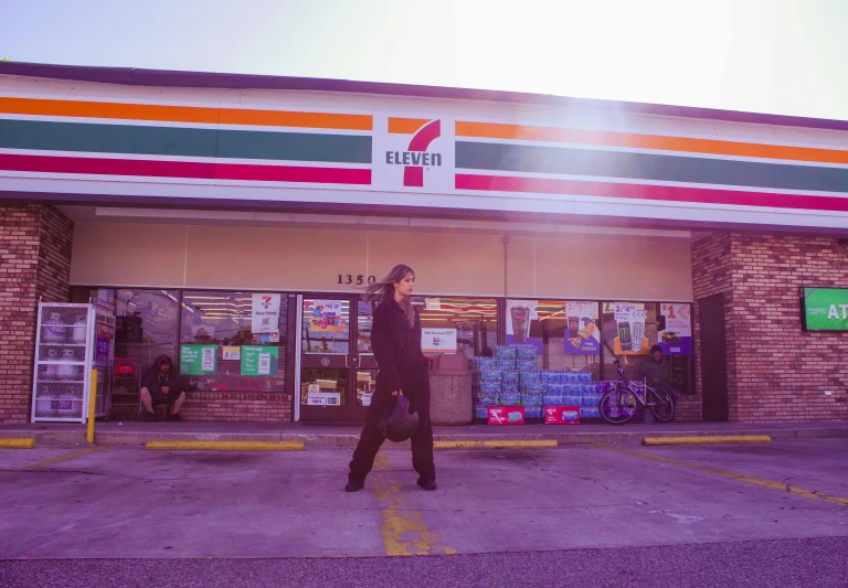 a man walking in front of a kris kris kris kris kris kris kris kris kris kris kris, an album cover, inspired by Elsa Bleda, unsplash, inside a gas station, portrait of keanu reeves, lorena avarez, william eggleston style