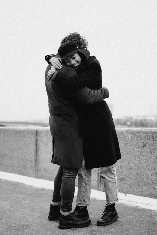 a couple of people that are hugging each other, instagram picture, ƒ5.6, bw, 256435456k film