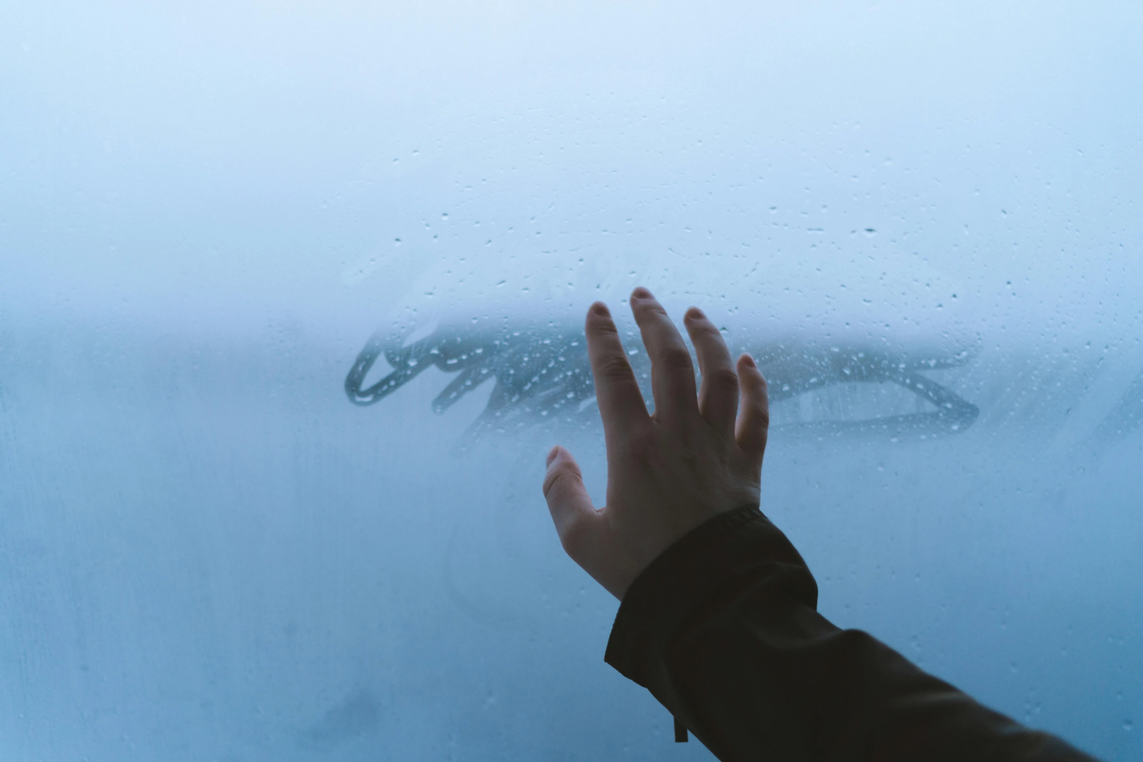 a person looking at a whale through a window, inspired by Elsa Bleda, pexels contest winner, visual art, arm reaching out of thick fog, background image, tears in the rain, hand with five fingers