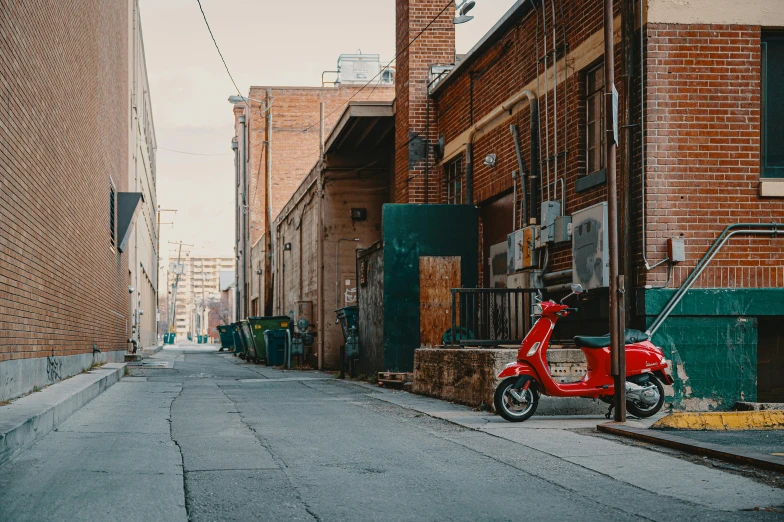 a red scooter parked on the side of a street, by Lee Loughridge, unsplash contest winner, back alley, downtown, midwest town, complex scene