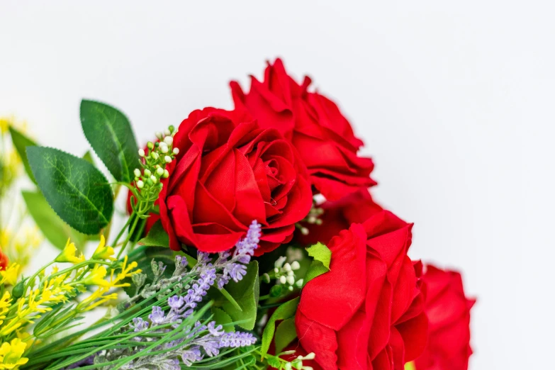 a bouquet of red roses sitting on top of a table, detailed product image, detail shot, cheery, close together