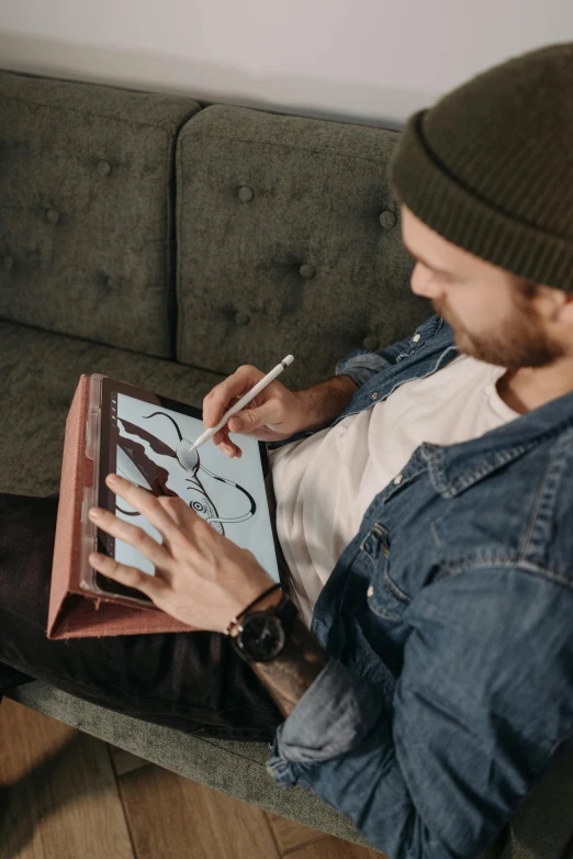 a man sitting on a couch using a laptop computer, a drawing, trending on pexels, arbeitsrat für kunst, digitally draw on wacom tablet, drawing an arrow from his quiver, brown, hand painted textures on model