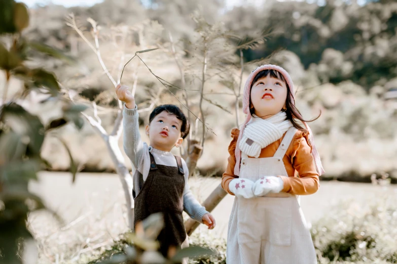 a couple of young children standing next to each other, pexels contest winner, manuka, avatar image, ad image, 🍁 cute