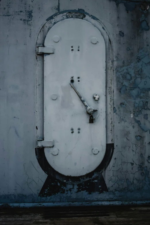 a clock that is on the side of a building, by Elsa Bleda, unsplash, graffiti, iron arc gate door texture, white grey blue color palette, watertank, ship control panel close-up