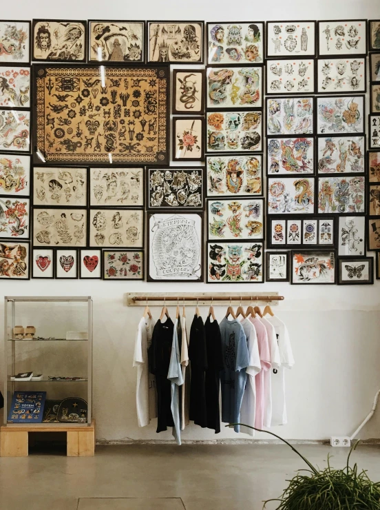 a room with a lot of tattoos on the wall, a cartoon, by Carey Morris, trending on unsplash, lyco art, embroidered robes, dezeen showroom, ✨🕌🌙, the store