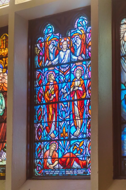 a group of stained glass windows in a church, a digital rendering, by Louis Comfort Tiffany, pexels, strong blue and orange colors, the three marys at the sepulchre, medium closeup shot, city views