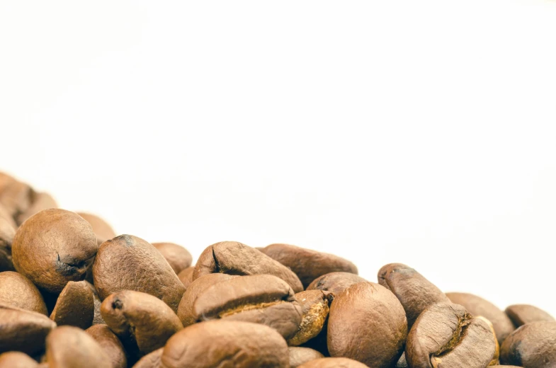 a pile of coffee beans sitting on top of each other, trending on unsplash, photorealism, background image, potato, product introduction photo, set against a white background