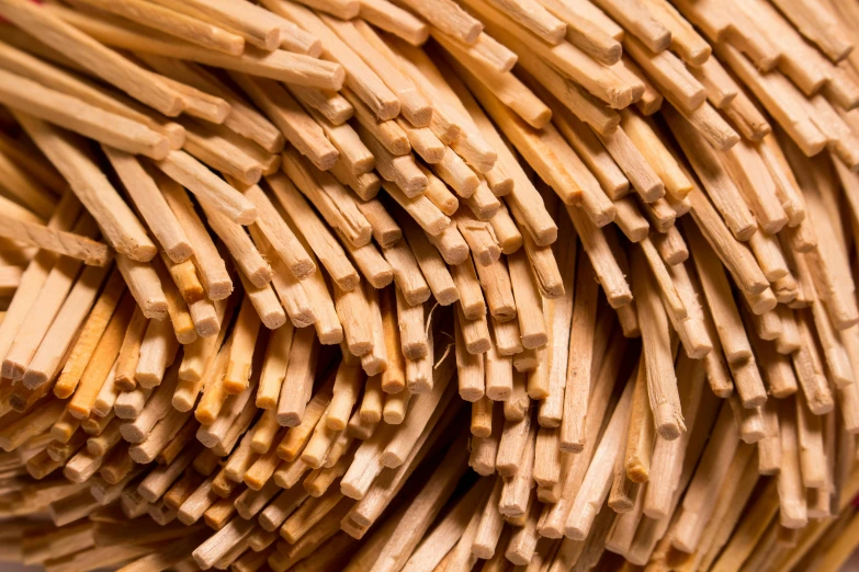 a pile of bamboo sticks stacked on top of each other, a macro photograph, by David Simpson, unsplash, made of spaghetti, vanilla, cedar, thumbnail
