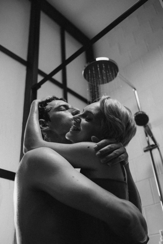 a man and a woman hugging in a bathroom, a black and white photo, showers, 🌺 cgsociety, square, item