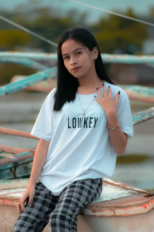 a beautiful young woman sitting on top of a boat, inspired by Rudy Siswanto, pixabay contest winner, lowbrow, plain white tshirt, in white lettering, l · lawliet, destroy lonely