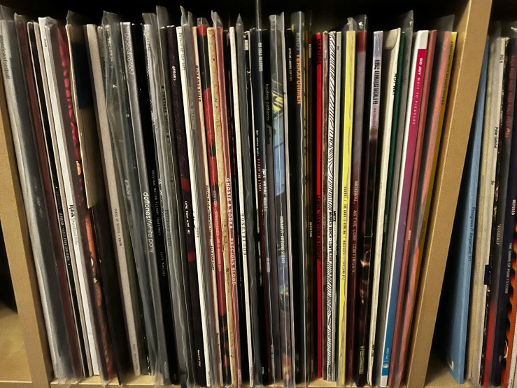 a close up of a bunch of records on a shelf, an album cover, large)}], thumbnail, stems, racks
