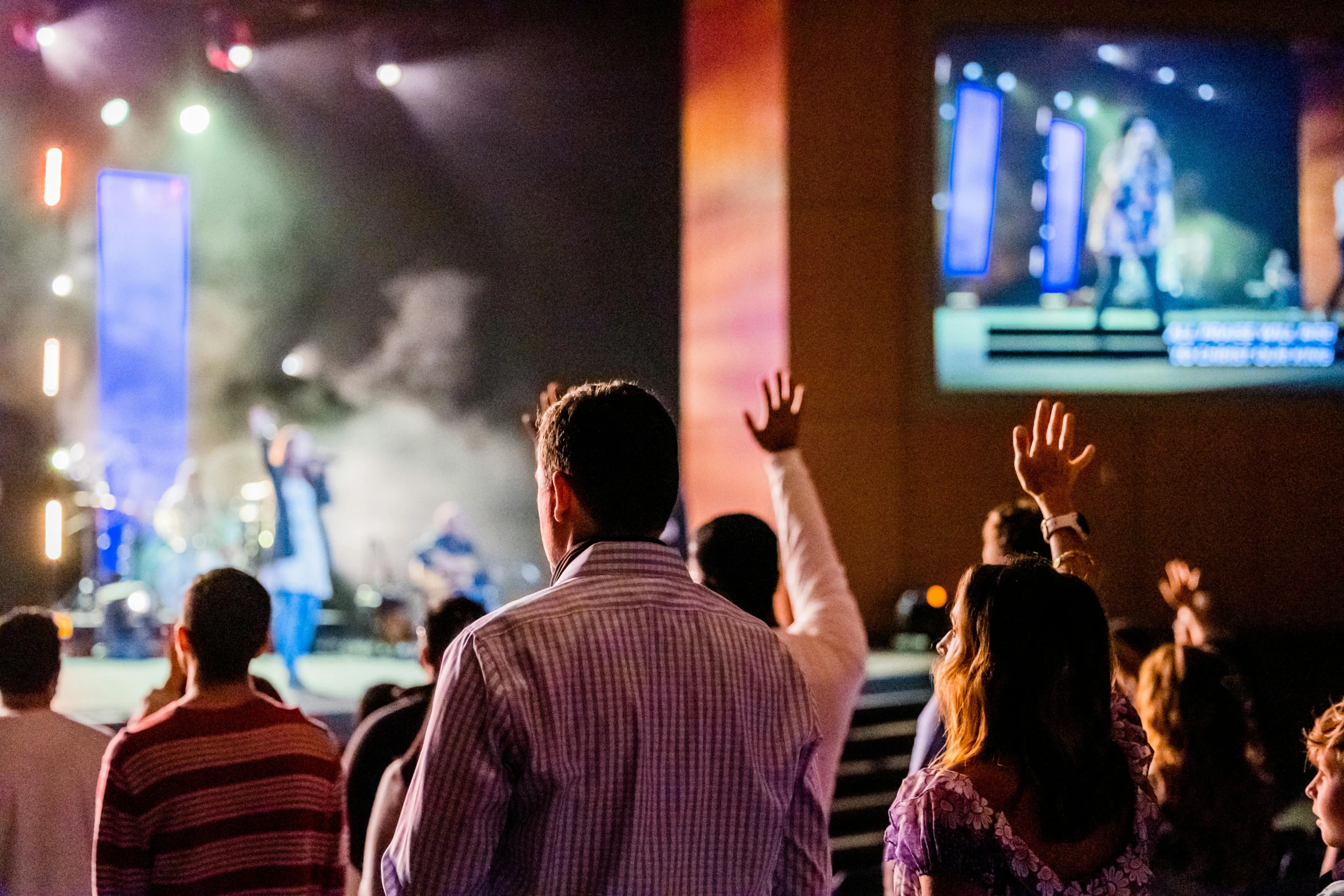 a group of people standing in front of a stage, worship, people watching, holy themed, uploaded