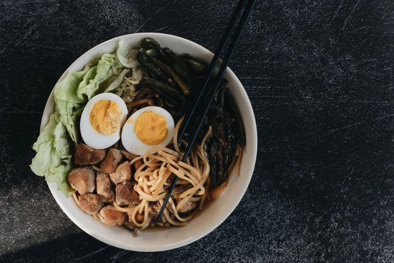 a close up of a bowl of food with chopsticks, square, background image, full body image, fan favorite