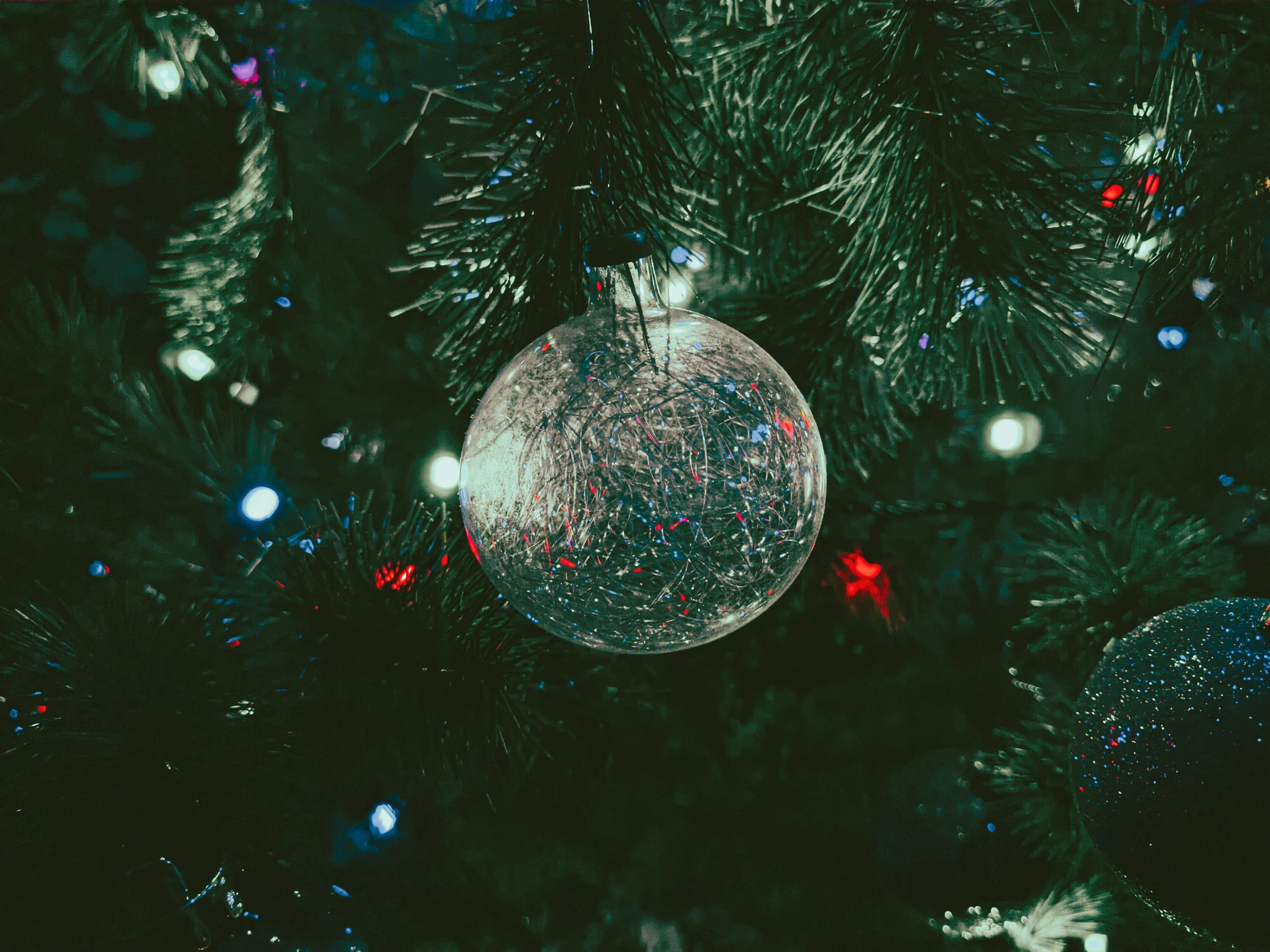 a close up of a christmas tree with ornaments, an album cover, pexels, glass sphere, green sparkles, blank, thumbnail