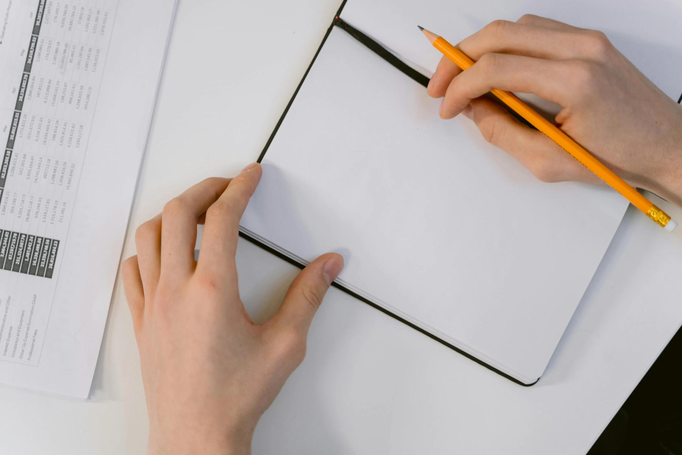 a person writing on a piece of paper with a pencil, pexels contest winner, white sketchbook style, square lines, background image, thumbnail