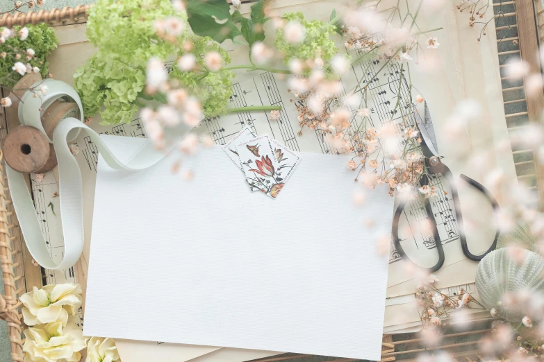 a bunch of papers sitting on top of a table, pexels contest winner, mail art, delicate garden on paper, background image, concert, beautiful image