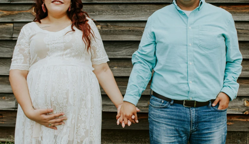 a man and a woman standing next to each other, trending on pexels, maternity feeling, extra fleshy hands, plus size, american gothic