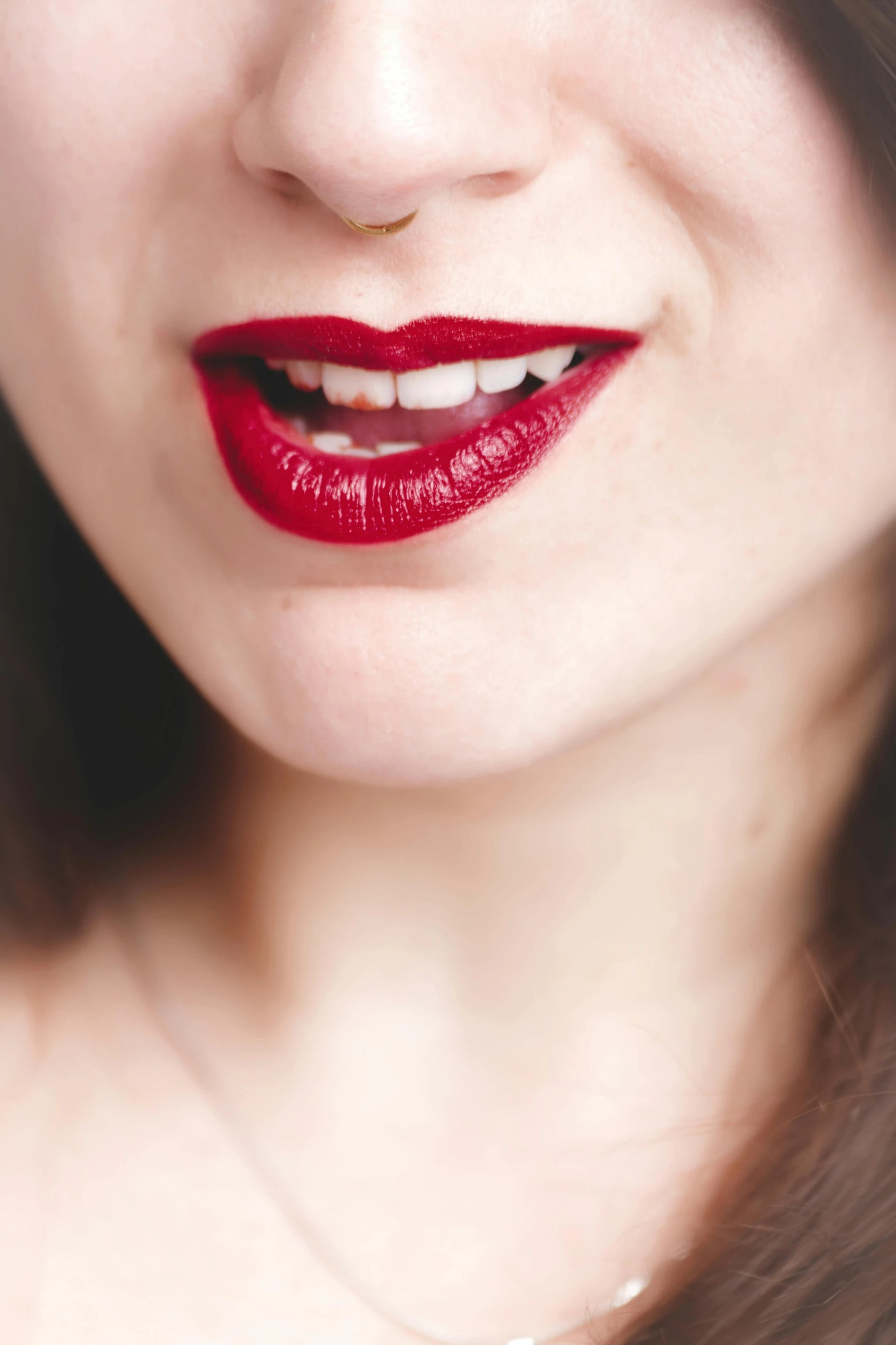 a close up of a woman with red lipstick, by Julia Pishtar, trending on pexels, renaissance, half onesided smile, mouth half open, red velvet, porcelain skin ”