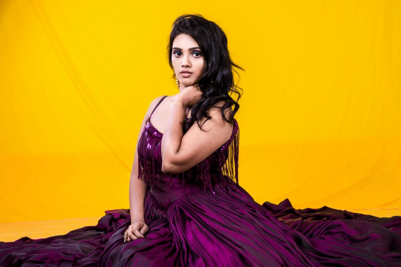 a woman in a purple dress sitting on a bed, jayison devadas, various pose, profile image, square