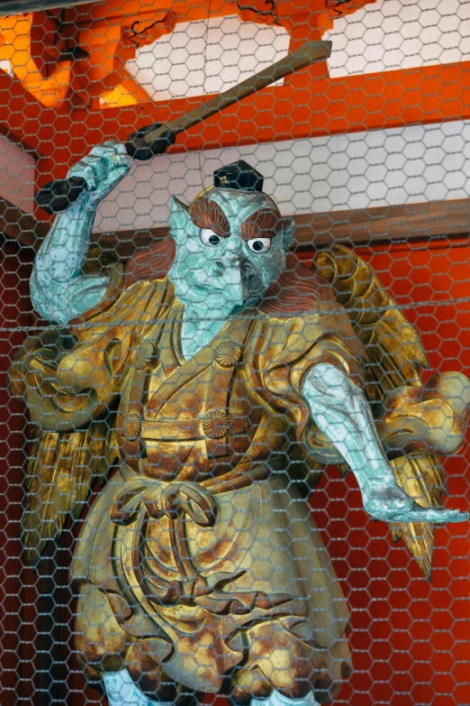 a statue of a man holding a sword, a statue, inspired by Shunkōsai Hokushū, wizard holding a cage, compound eyes, part of the screen, in a temple