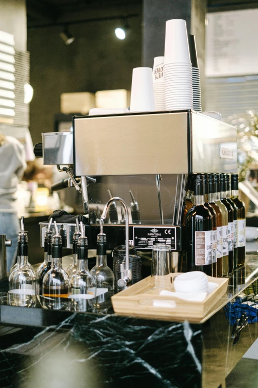 a coffee machine sitting on top of a counter, by Niko Henrichon, unsplash, renaissance, wine, at checkout, many small details, thumbnail