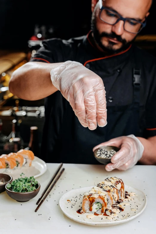 a man in a chef's uniform putting sushi on a plate, gloves on hands, city views, true to life, te pae