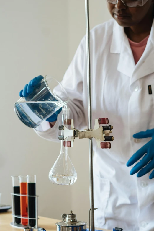 a woman in a lab coat and blue gloves, pexels, analytical art, pouring, lab coat and tee shirt, multi-part, thumbnail