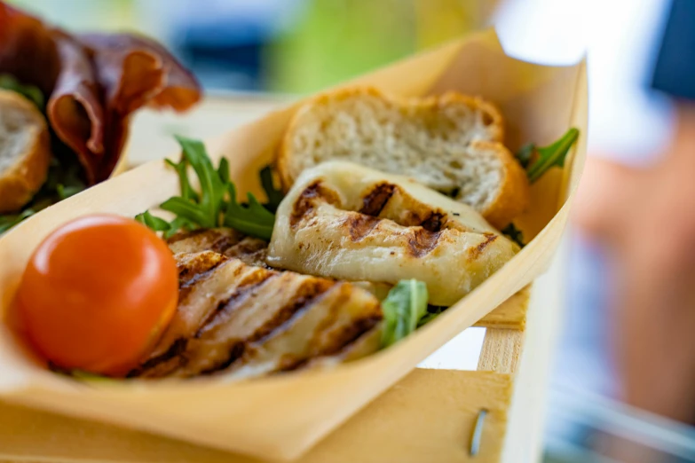 a close up of a plate of food on a table, having a picnic, bay area, square, grill