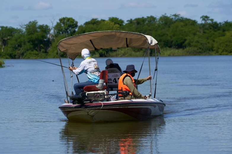 a couple of people riding on top of a boat, fishing, in louisiana, tournament, best photo