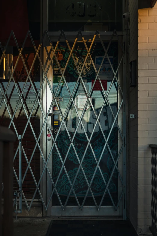 a red fire hydrant sitting in front of a building, an album cover, by Jacob Burck, unsplash, art nouveau, elevator doors look like a mouth, lattice, restaurant exterior photography, glass and steel