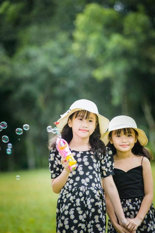 two little girls are playing with soap bubbles, a picture, by Yosa Buson, portrait image, hoang long ly, square, scenery