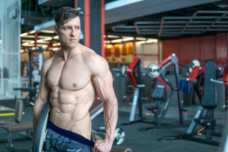 a man posing for a picture in a gym, by Adam Marczyński, 30 year old man :: athletic, indoor picture, super realistic photo, high quality upload