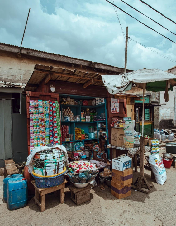 a small market on the side of the road, by Daniel Lieske, pexels contest winner, very kenyan, thumbnail, shop front, gif