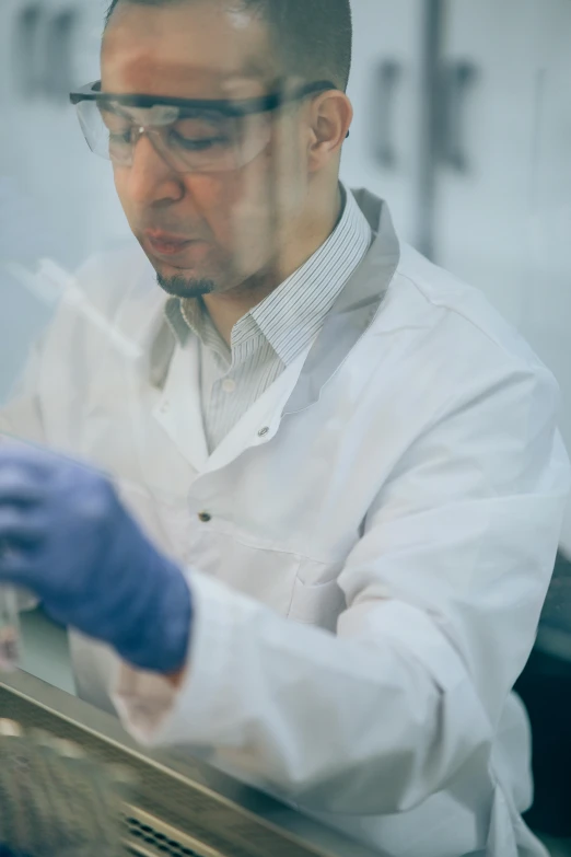 a man in a lab coat and blue gloves, refik anadol, plating, profile image, islamic