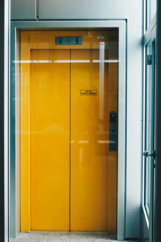 an elevator with a yellow door in a building, unsplash, square, lacquered glass, thumbnail, multi - coloured