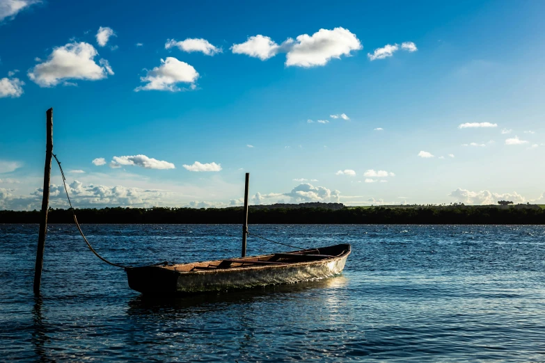 a boat floating on top of a body of water, by Peter Churcher, pexels contest winner, hurufiyya, azure blue sky, thomas river, thumbnail, skiff