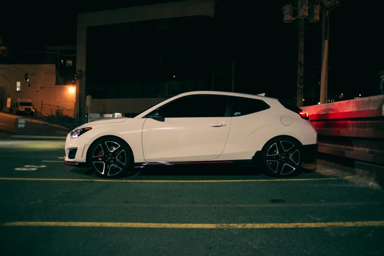 a white car parked in a parking lot at night, inspired by An Gyeon, pexels contest winner, black steel with red trim, side angle, ds, profile picture